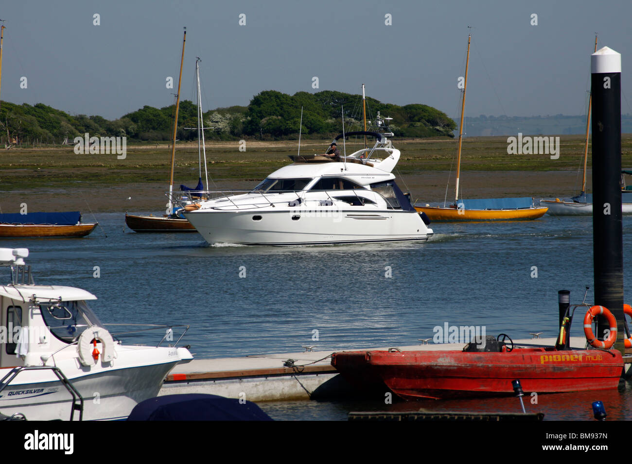 Boat,cruiser,motor yacht,mooring,sailing,river,sea,lymington river,white,motorboat, motor cruiser Stock Photo