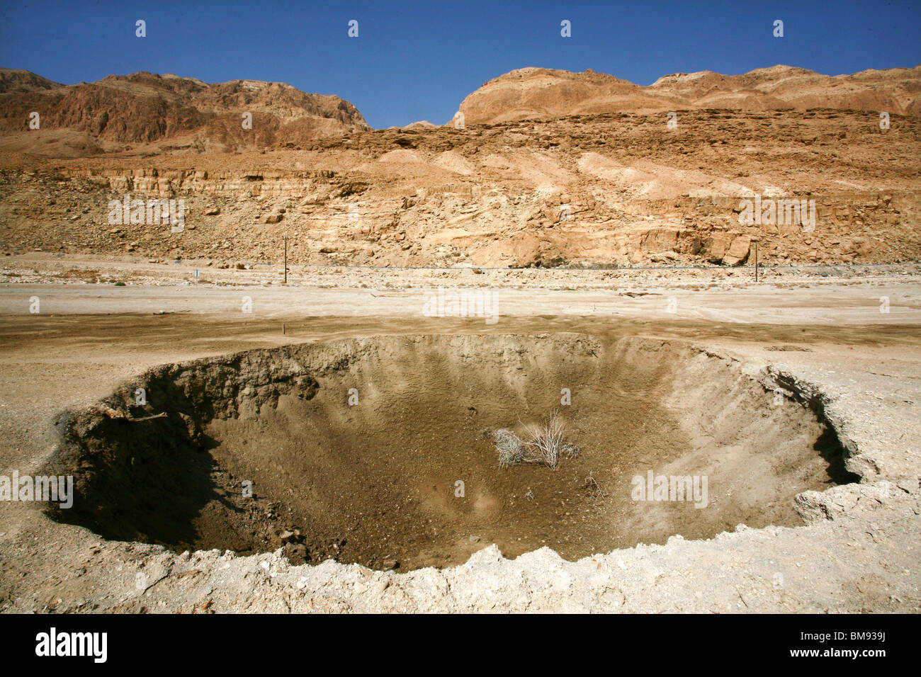 Israel, Dead Sea A sinkhole caused by the receding water level of the Dead Sea Stock Photo