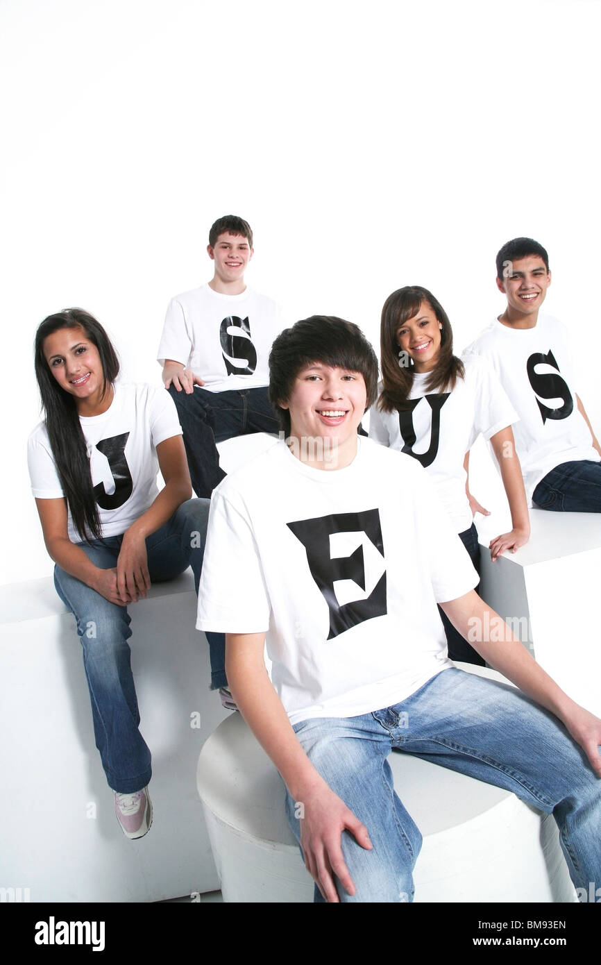 Five Teenagers With T-Shirts Spelling Jesus Stock Photo