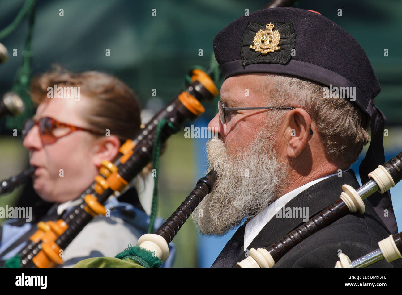 Member of bagpipe band playing in 2010 Victoria Highland games-Victoria, British Columbia, Canada. Stock Photo