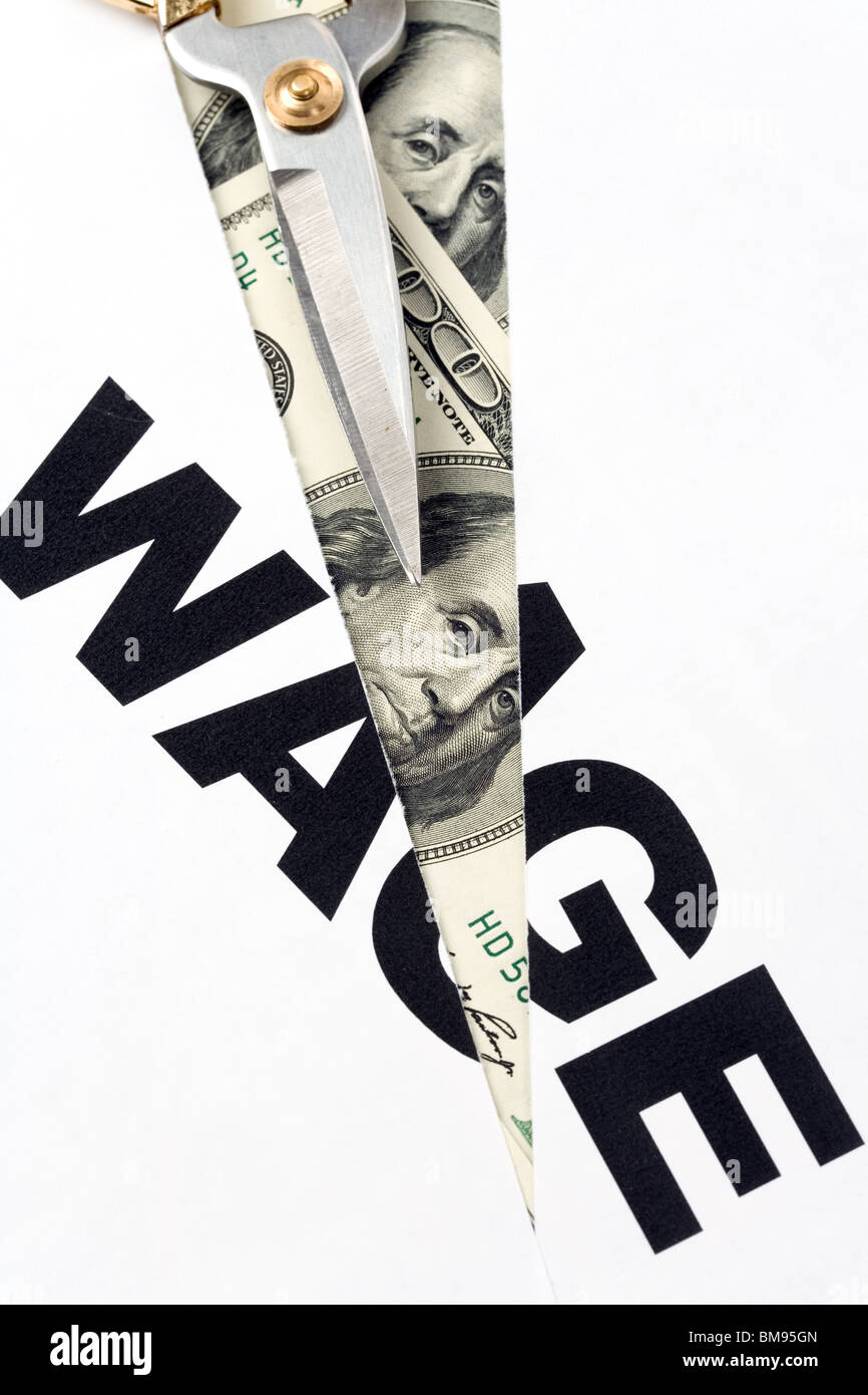 text of wage and scissors, concept of salary cut Stock Photo