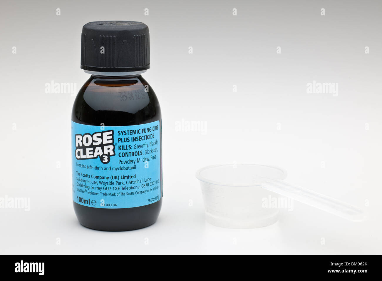 100 ml bottle of Rose Clear Systemic fungicide and measuring spoon Stock Photo