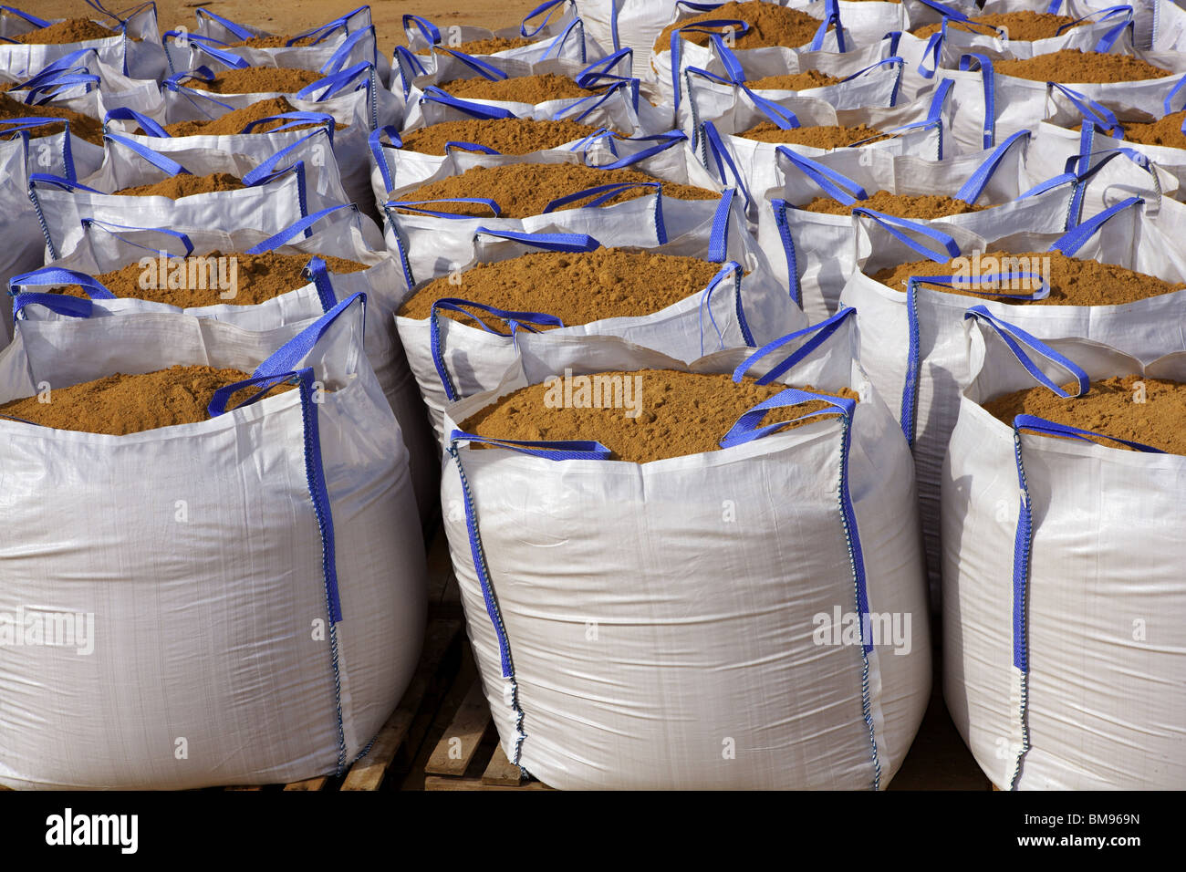 sandbag white big bag sand sacks on quarry Stock Photo - Alamy