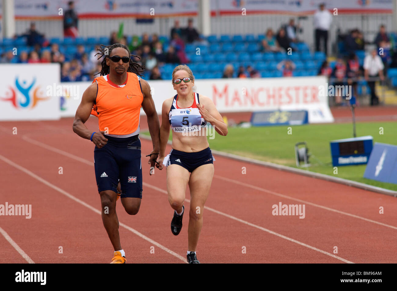 visually impaired runner and guide at the paralympic world cup held in manchester 2010 Stock Photo