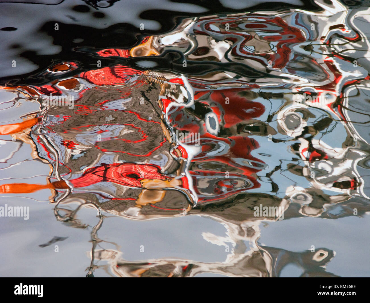 Abstract Reflection of Fishing Boat in Ocean Stock Photo