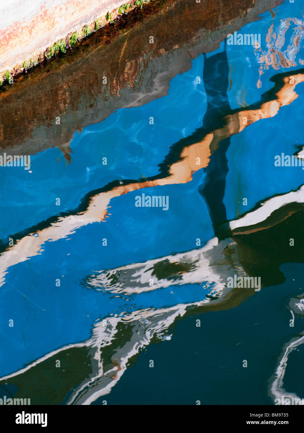 Abstract Reflection of Fishing Boat in Ocean Stock Photo - Alamy