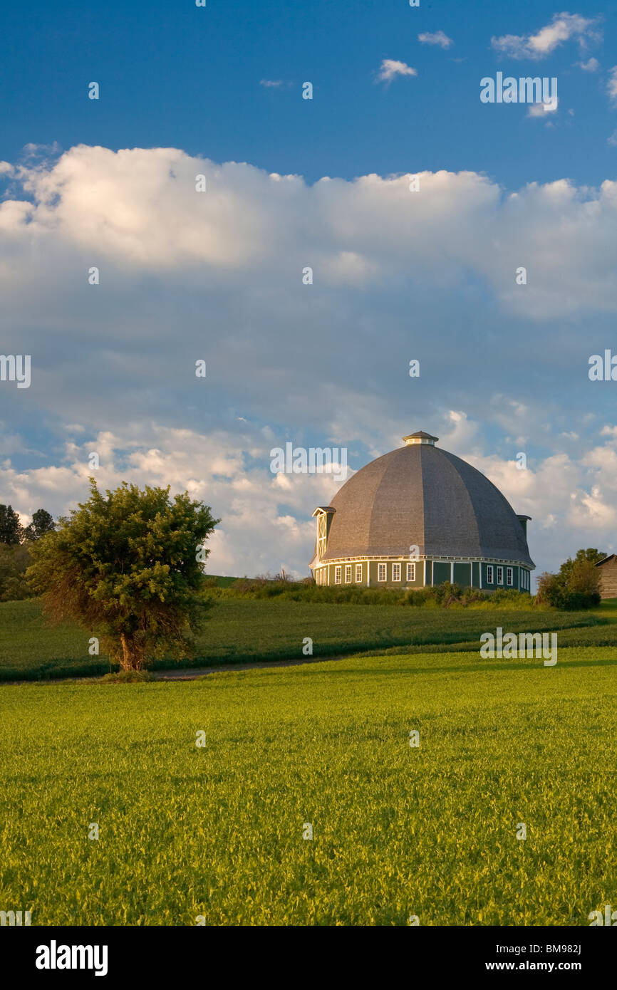 Whitman County, WA Morning sun on round barn under clearing skies Stock Photo