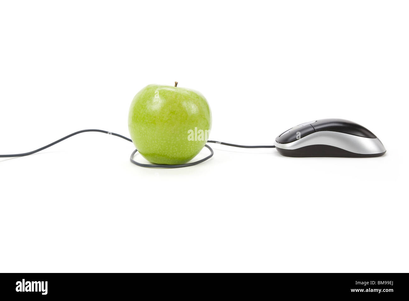 green apple and computer mouse, concept of online learning Stock Photo