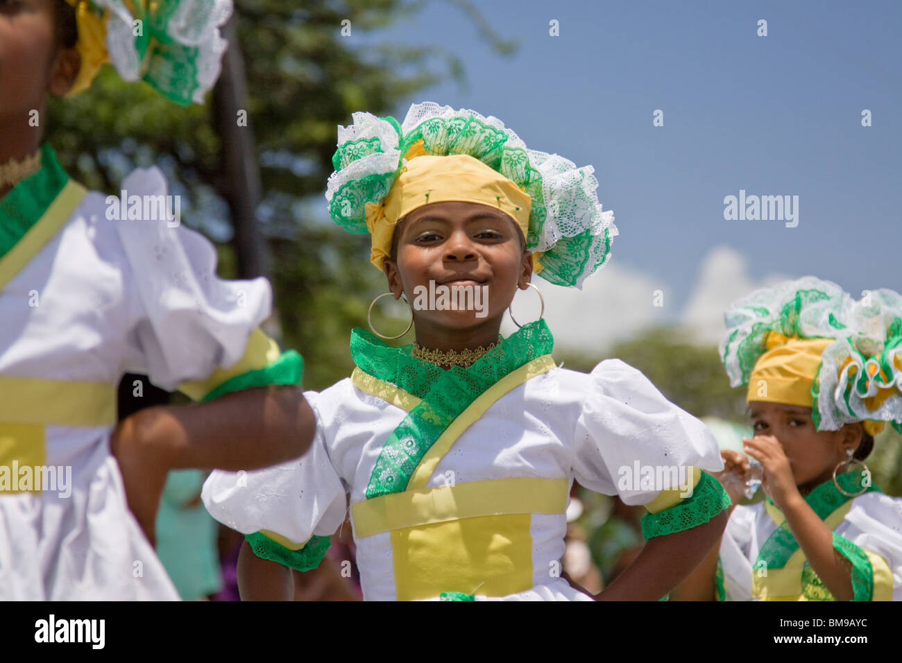 Young girl dressed in colorful costumes dance during Harvest Festival, Willemstad, Curacao, Netherlands Antilles, Caribbean. Stock Photo