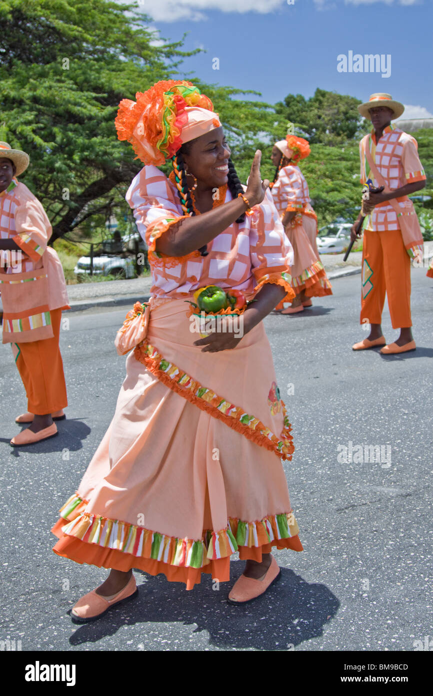 A woman dressed in colourful costume dances during Harvest Festival,  Willemstad, Curacao, Netherlands Antilles, Caribbean Stock Photo - Alamy