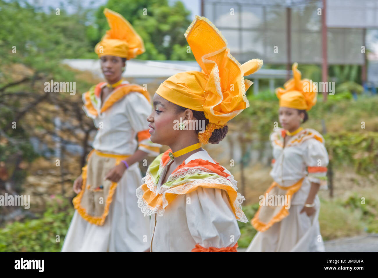 Young girl dressed in colorful costumes dance during Harvest Festival, Willemstad, Curacao, Netherlands Antilles, Caribbean. Stock Photo