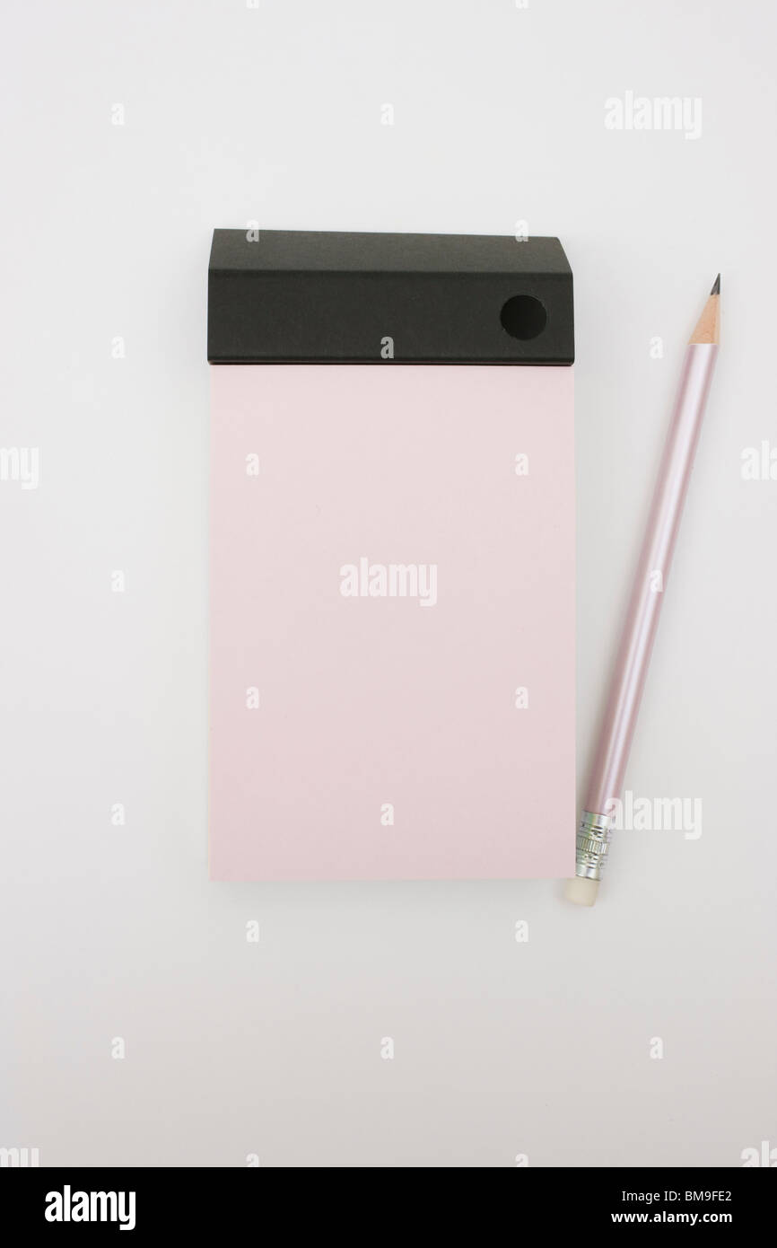 Pencil and note pad on white background Stock Photo