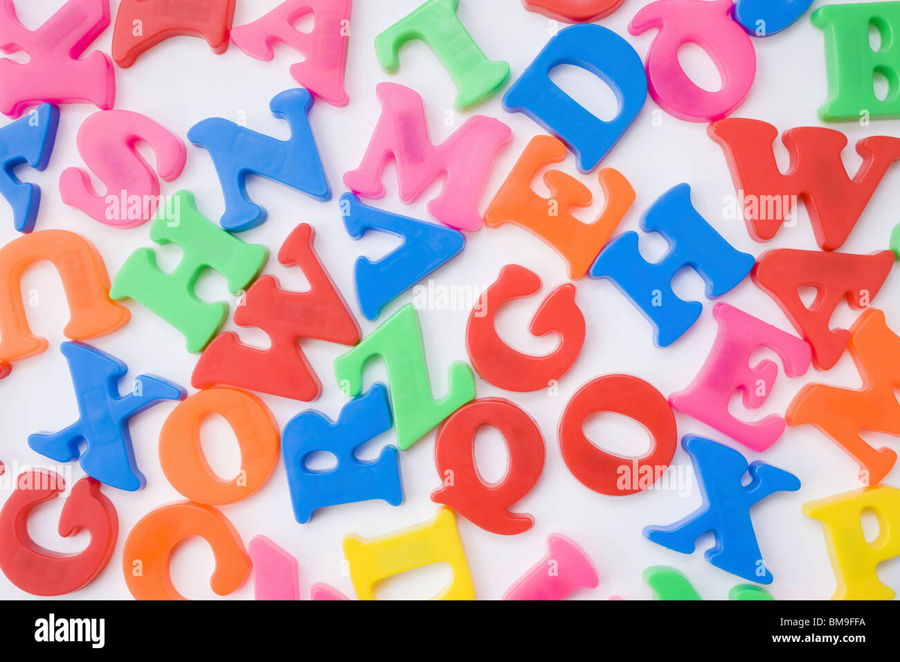 Letter magnets, close up, white background, full frame Stock Photo