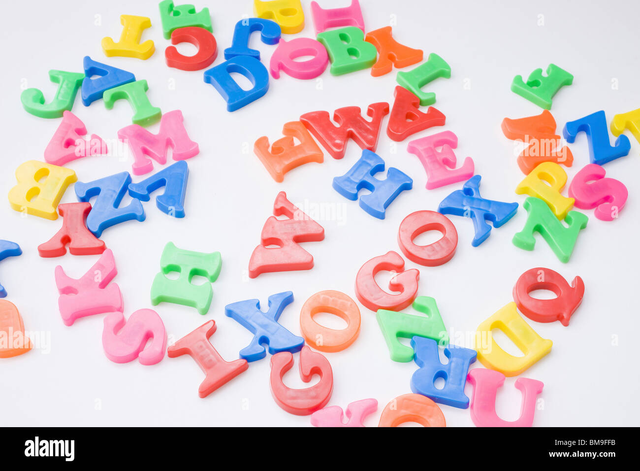 Letter magnets, white background Stock Photo - Alamy