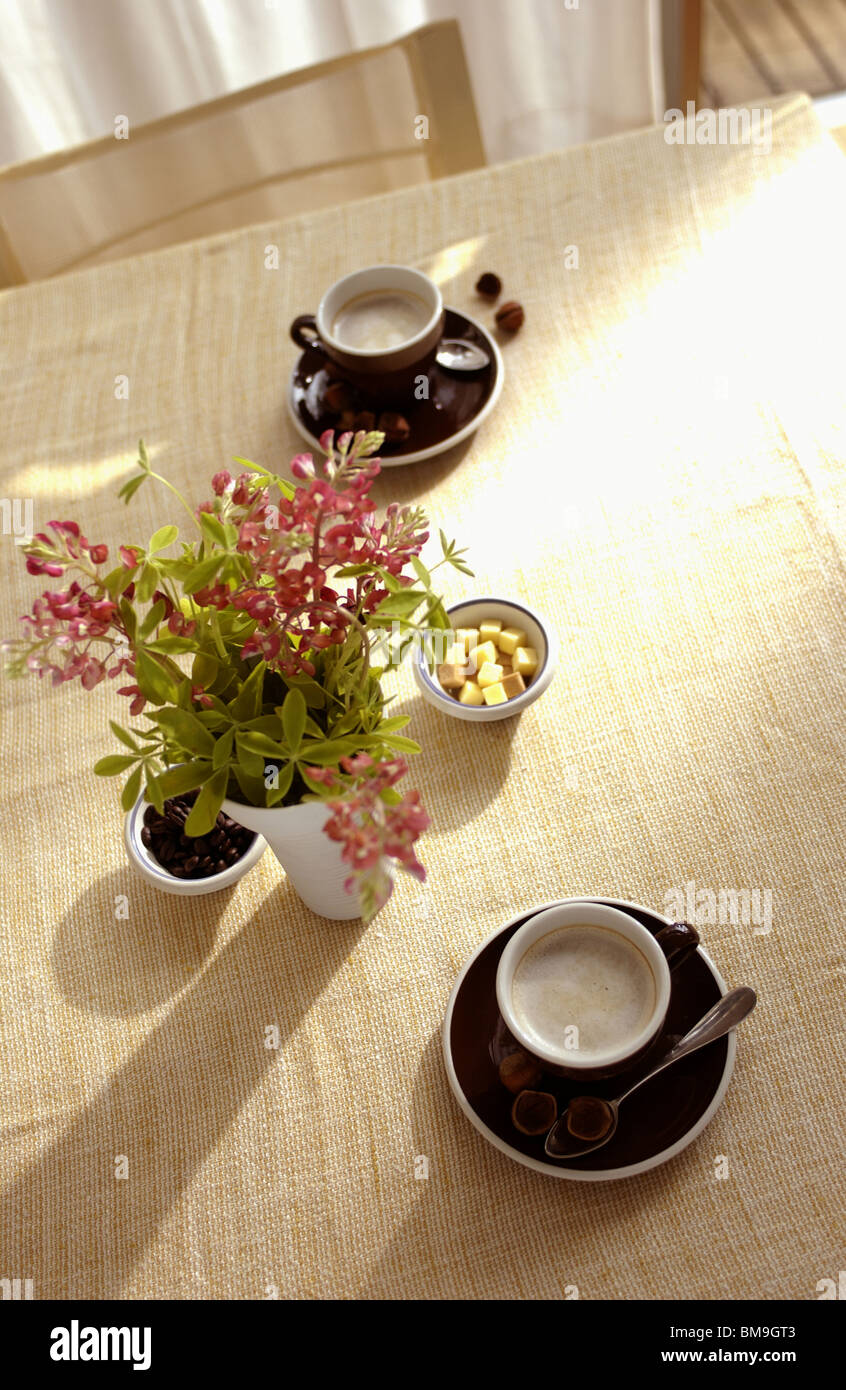 Cup of Coffees on dining table Stock Photo - Alamy
