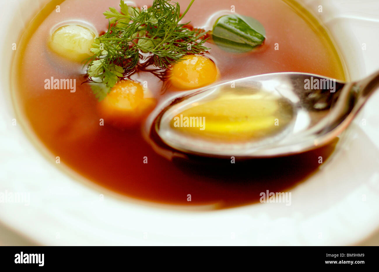 Bowl of consomme soup, close up Stock Photo