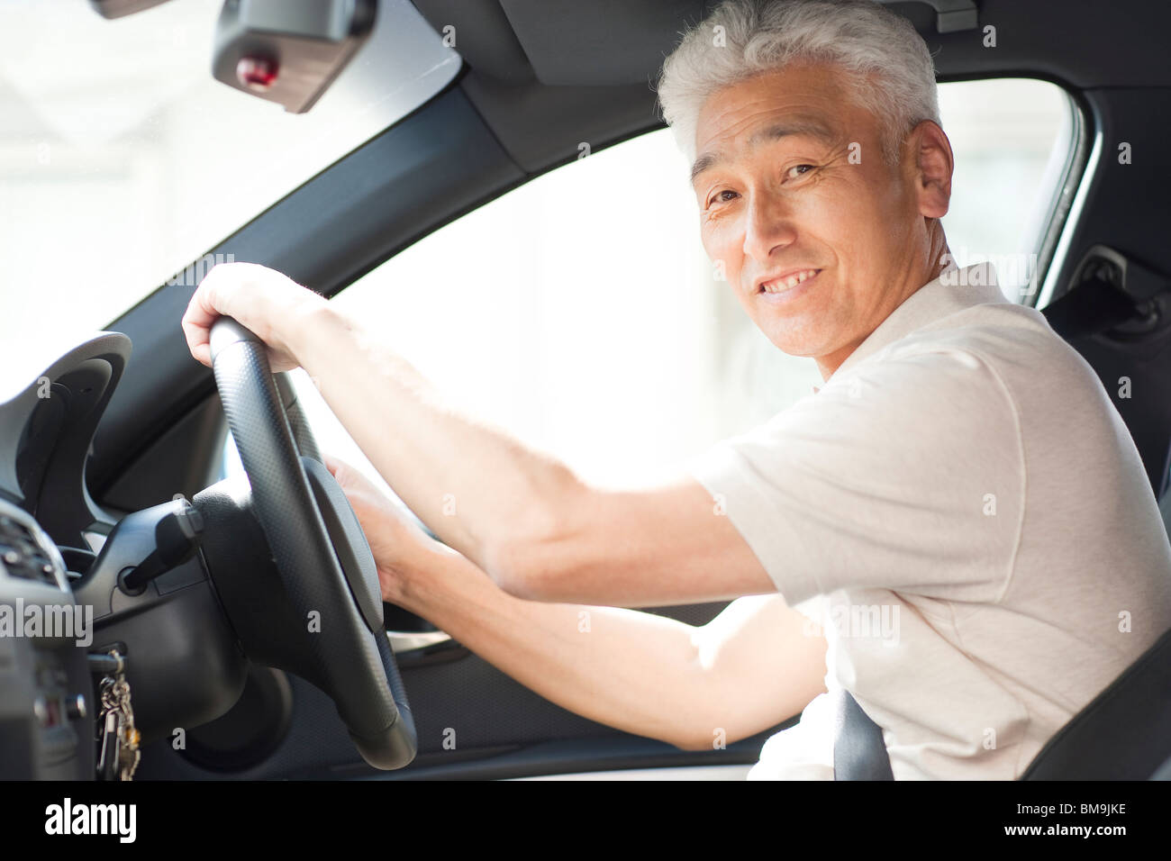 Smiling man steering wheel hi-res stock photography and images - Alamy