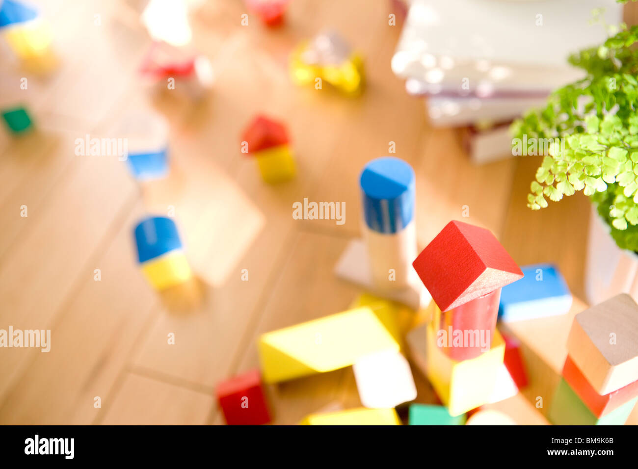 Wooden blocks on floor, differential focus Stock Photo - Alamy