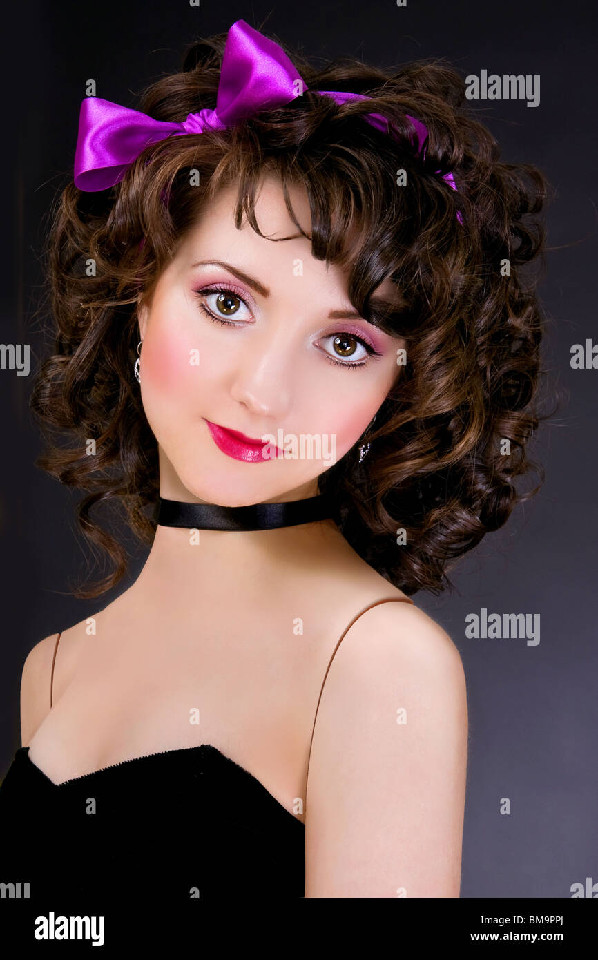 portrait of beautiful girl with bow on black background Stock Photo - Alamy