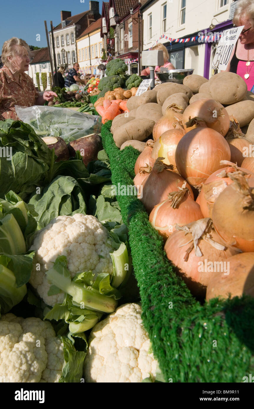 fresh fruit and veg vegetable vegetable on market stall food retail retailing shoppers buy buying handling produce shopping choi Stock Photo