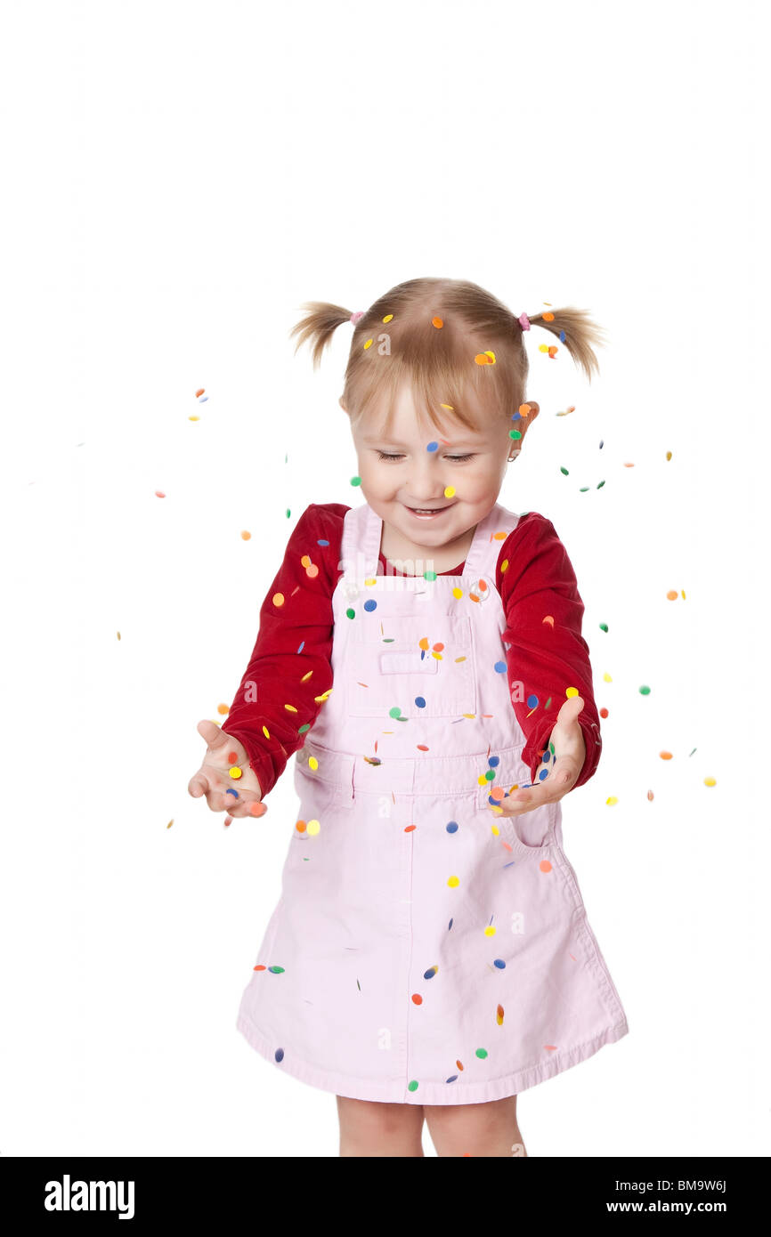the happy little girl with confetti Stock Photo Alamy