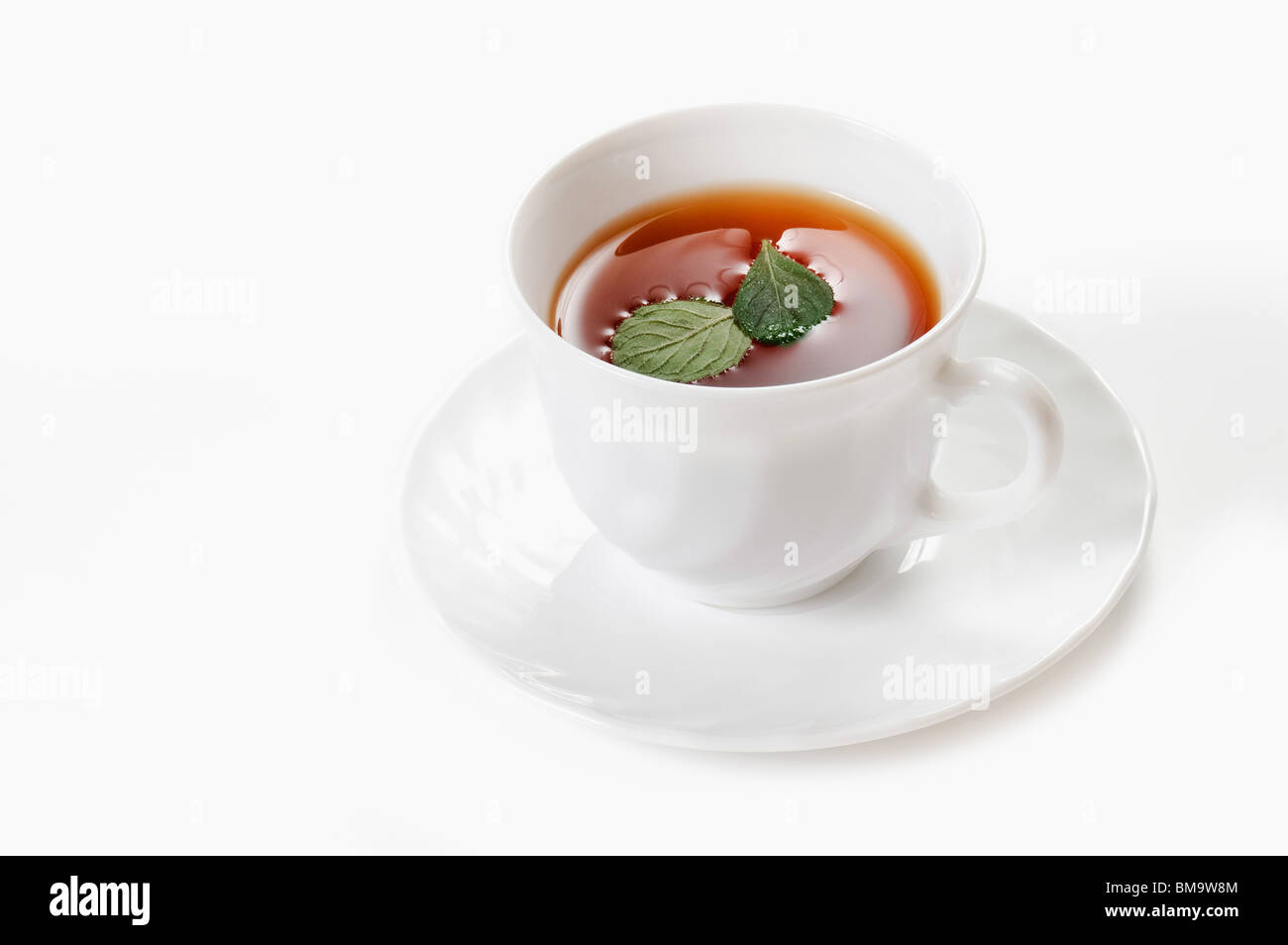 Cup of tea with mint over white (not isolated) Stock Photo