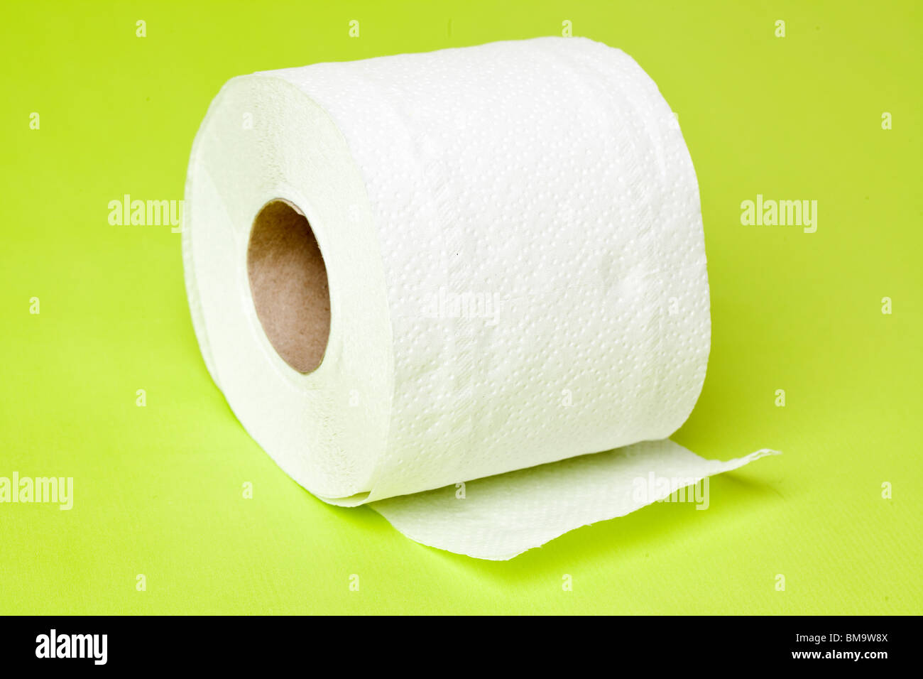 toilet paper on green background Stock Photo