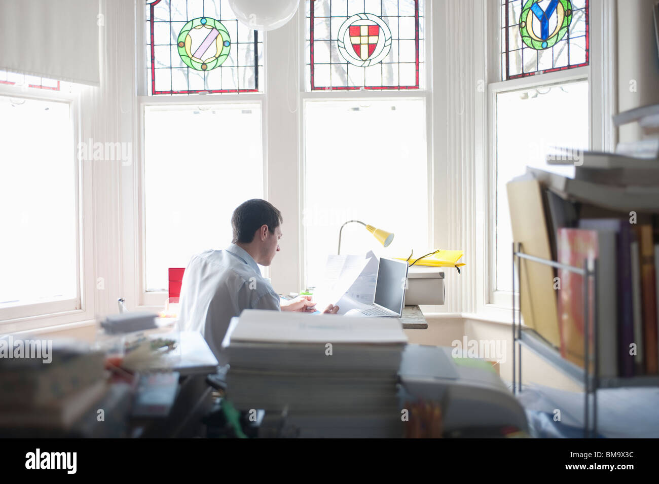 Businessman Works From Desk In Bay Window Stock Photo 29721536