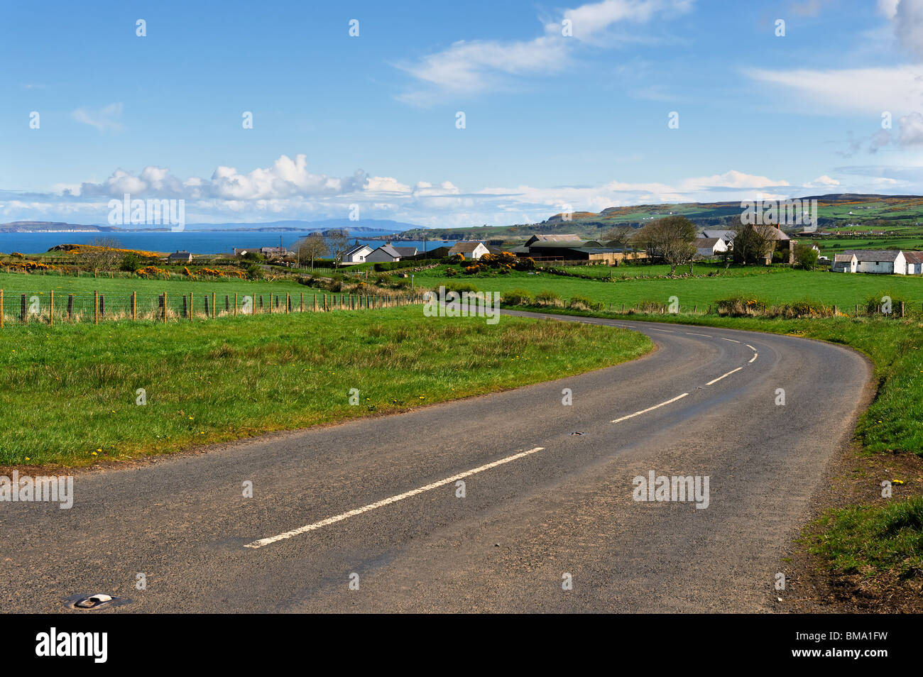 On the North Antrim Causeway Coast road looking North East towards Dunseverick and Rathlin Island beyond Stock Photo