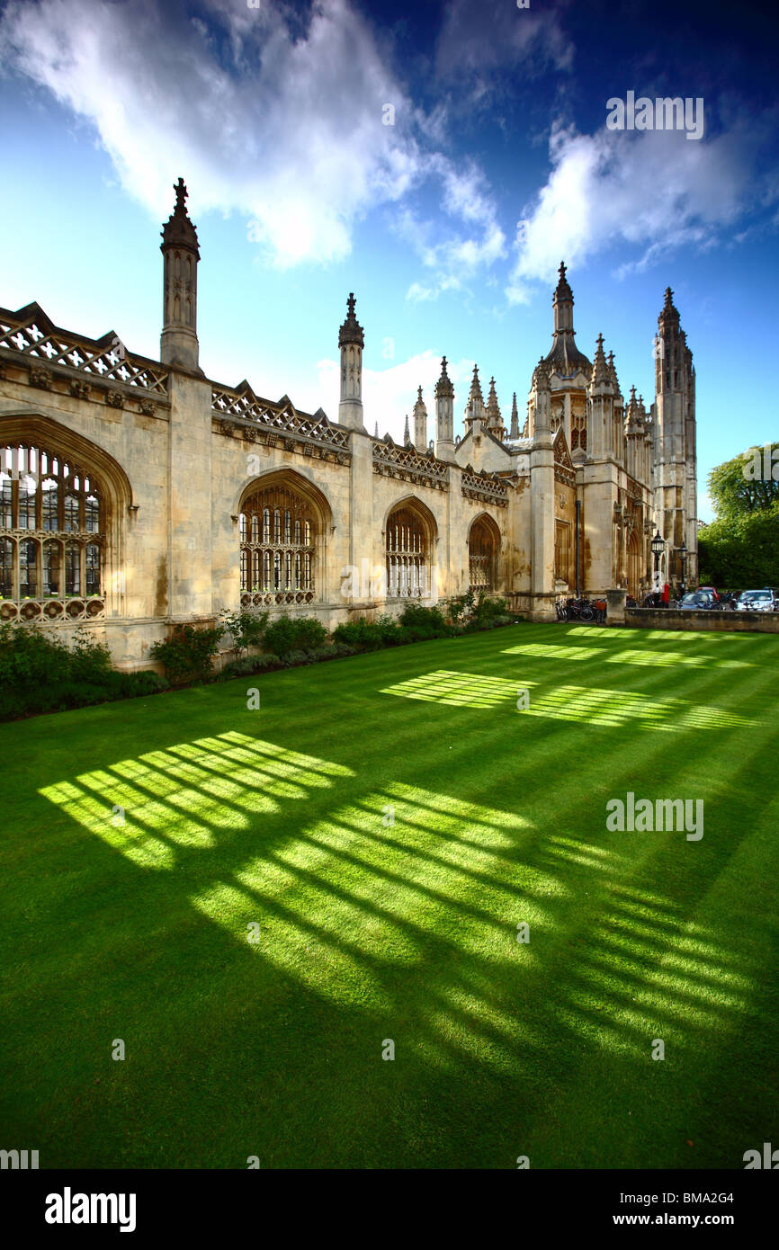 View of King's College, Cambridge, from King's Parade. Blue skies and vibrant cut grass, with the late sun cutting through. Stock Photo