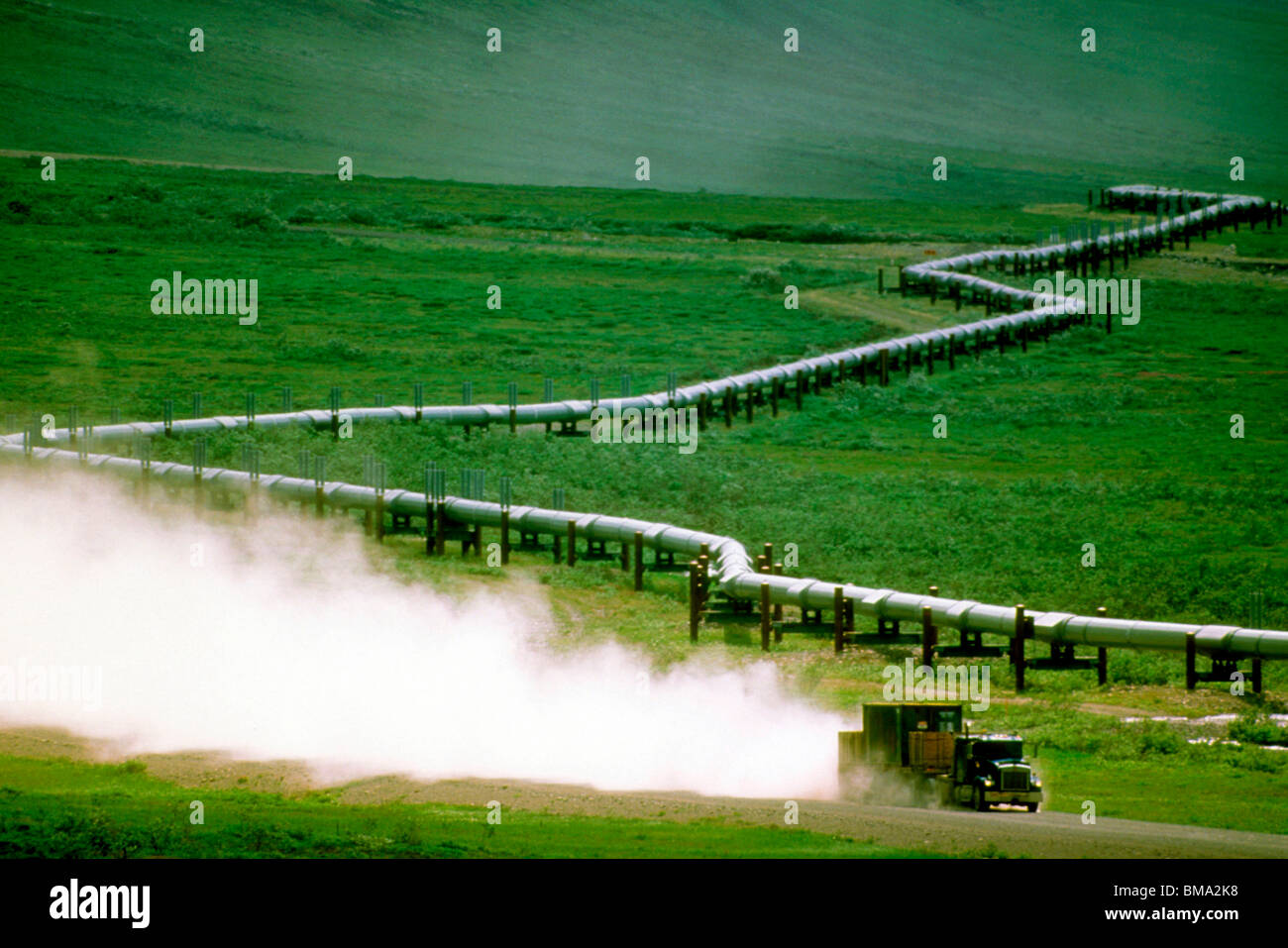 Oil pipeline with truck Stock Photo - Alamy