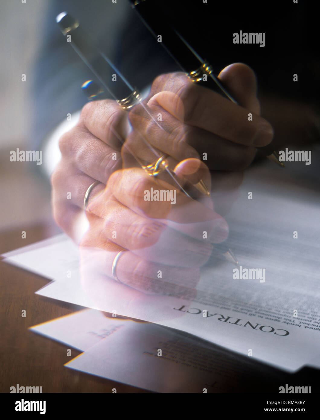 Businessman Signing Contract - multiple Exposure Stock Photo