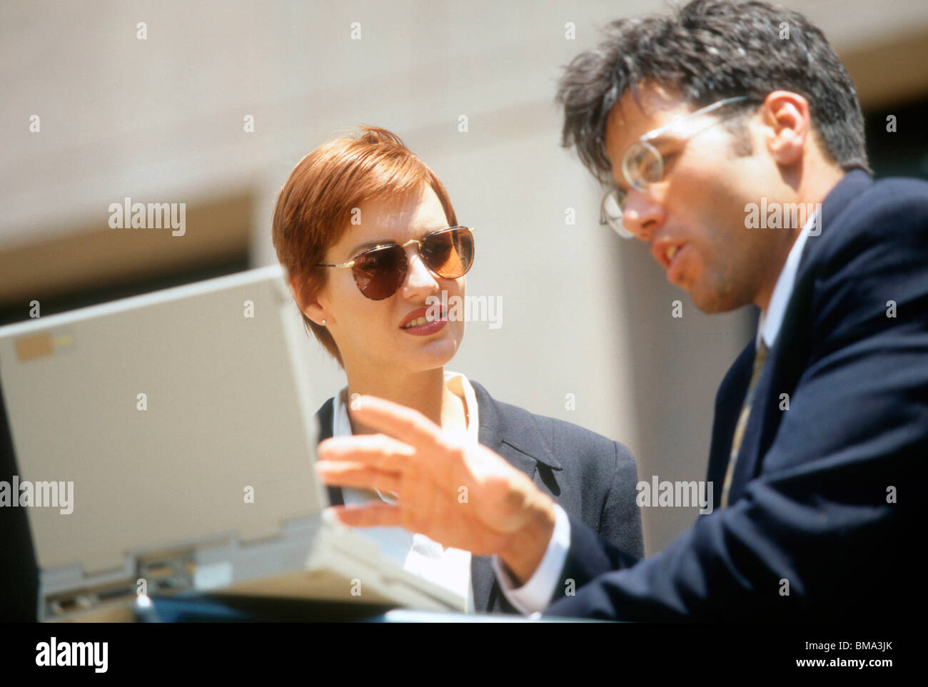 Business people have a quick meeting during lunch break. Stock Photo