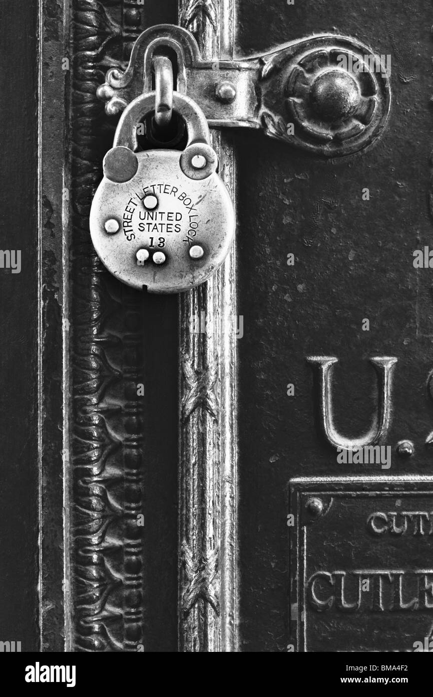 Padlock secures a postal letter box. Stock Photo