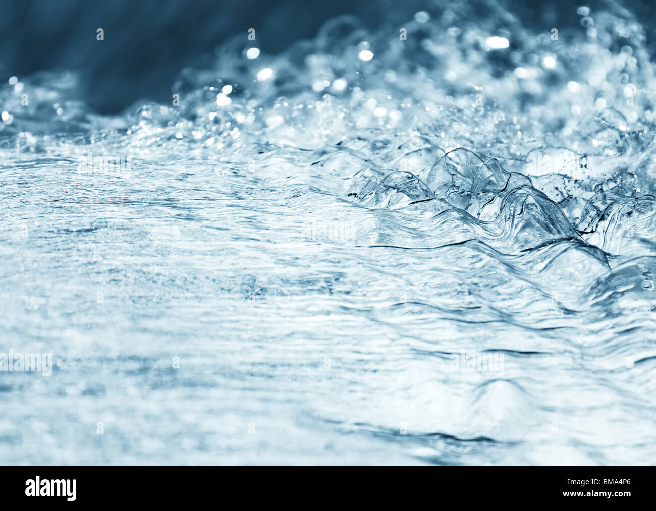 Water stream. Soft blue tint. Stock Photo