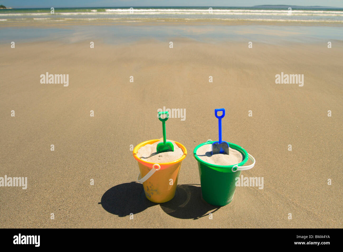 Sand pails on beach Stock Photo Alamy