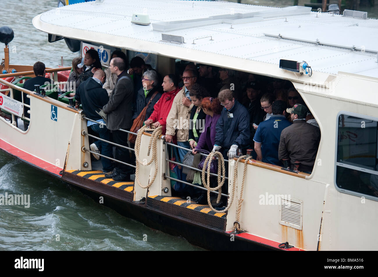 Italians on commuter water bus in Venice Italy Stock Photo