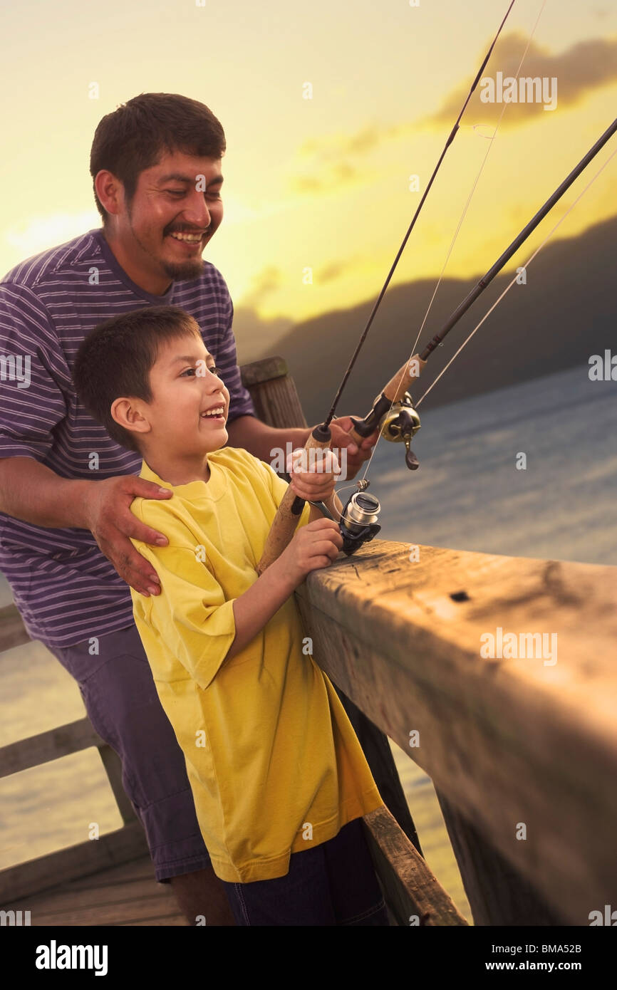 A Father Fishing With His Son Stock Photo - Alamy