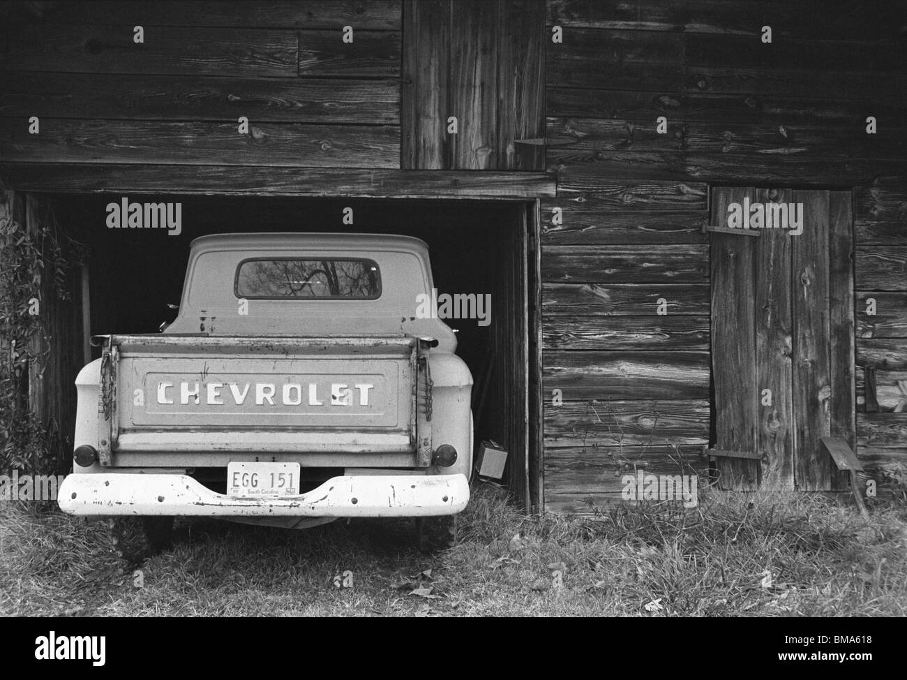 Old truck and barn. Stock Photo