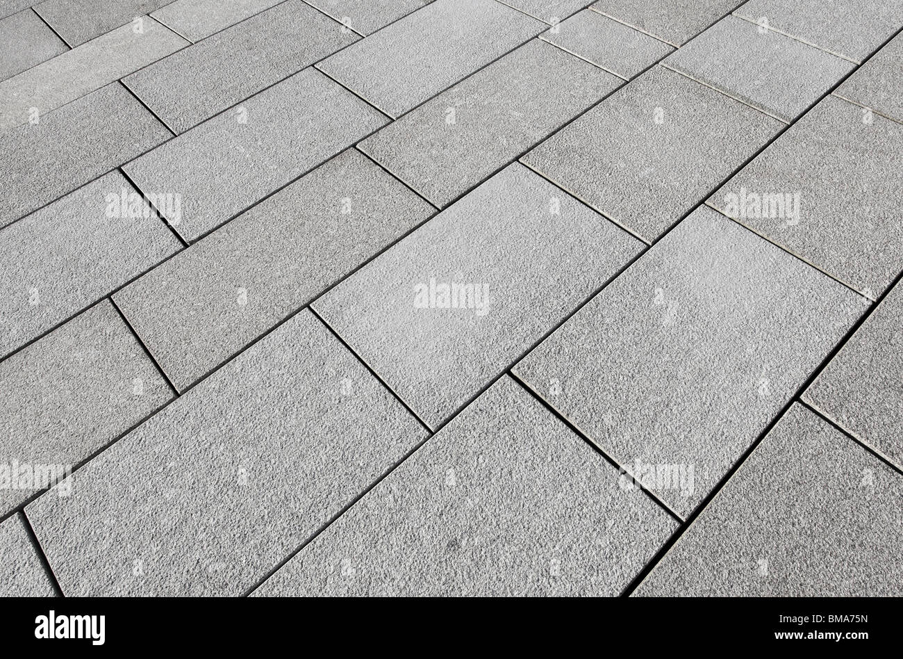 Large grey paving slabs close up. Stock Photo