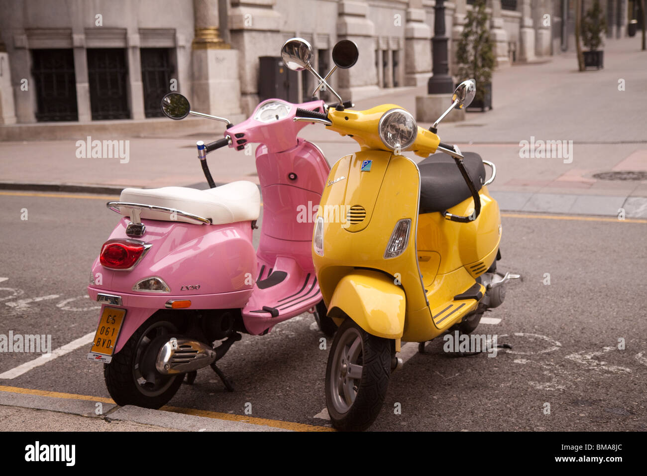 Two Vespa scooters parked in Oviedo Spain Stock Photo