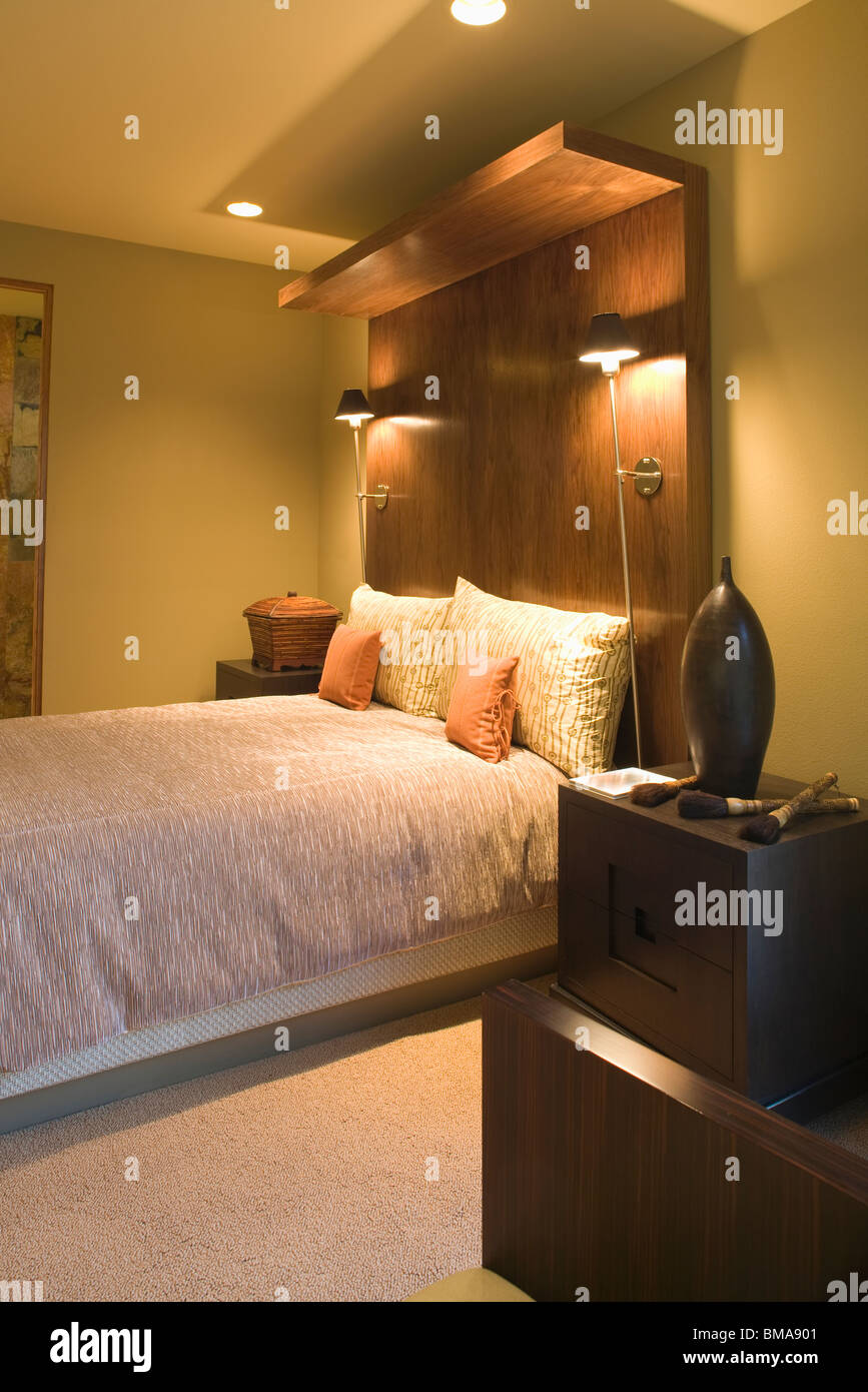 Double bed with oversized wooden headboard Stock Photo Alamy