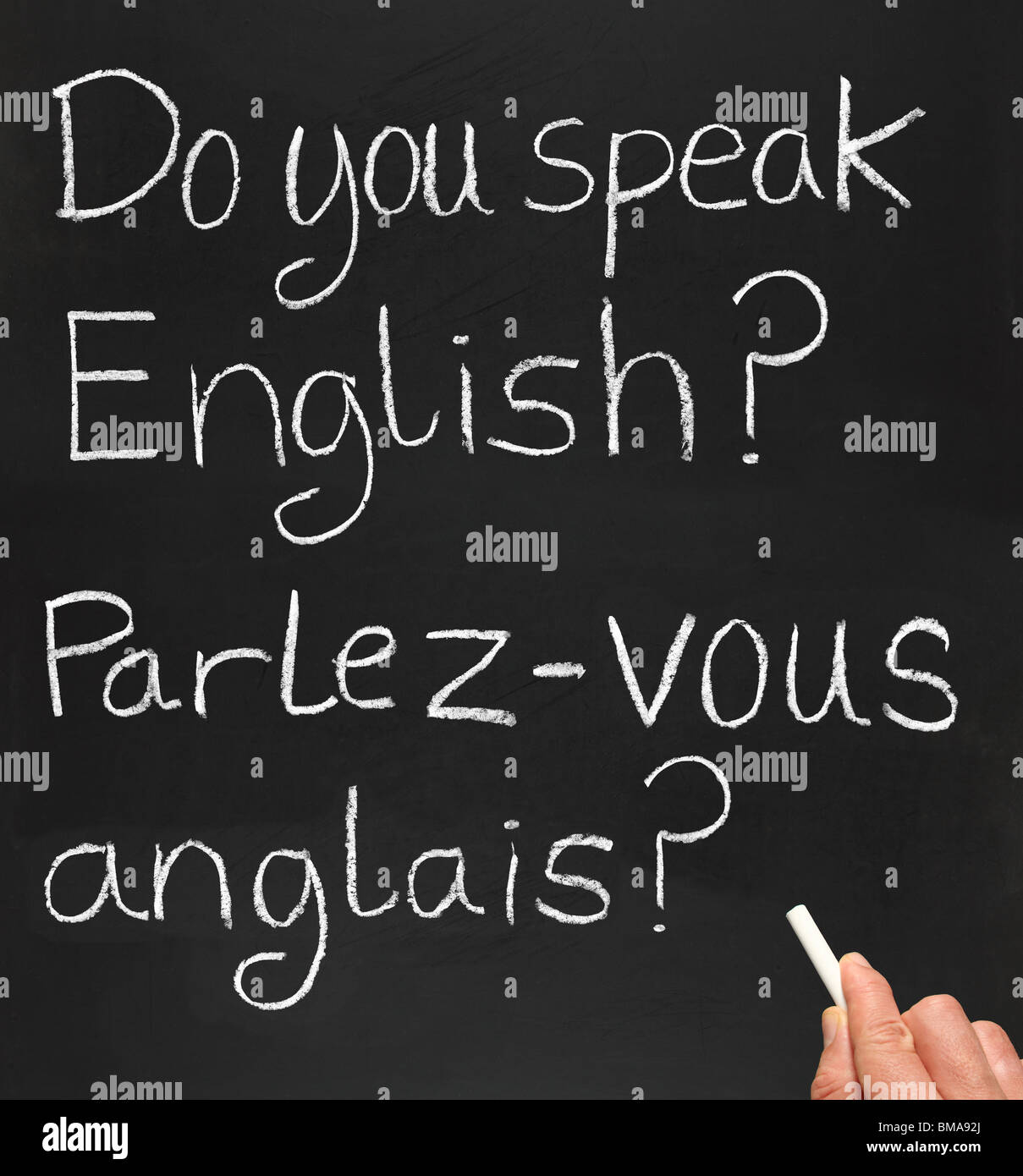 A Teacher Writing do You Speak English In French On A Blackboard Stock 