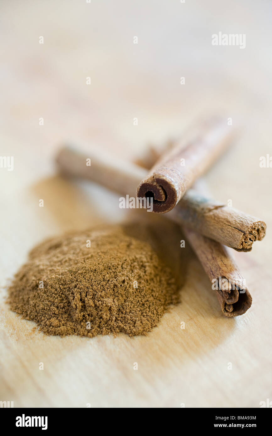 Ground cinnamon and cinnamon sticks Stock Photo Alamy