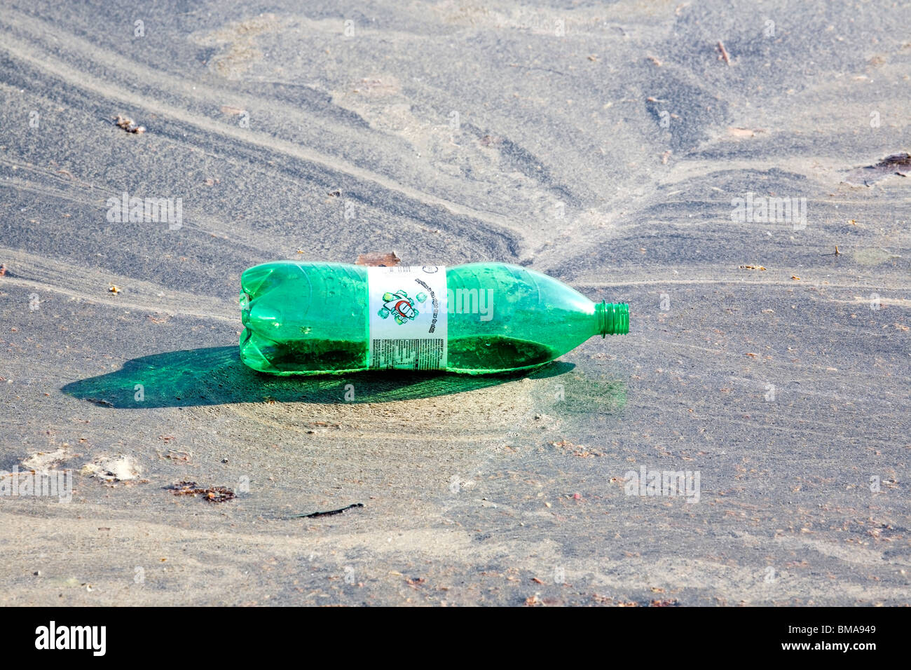 plastic 7up bottle floating on water Stock Photo