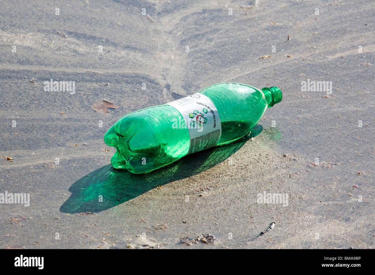 plastic 7up bottle floating on water Stock Photo