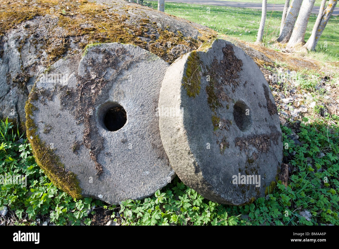 two old millstones Stock Photo Alamy