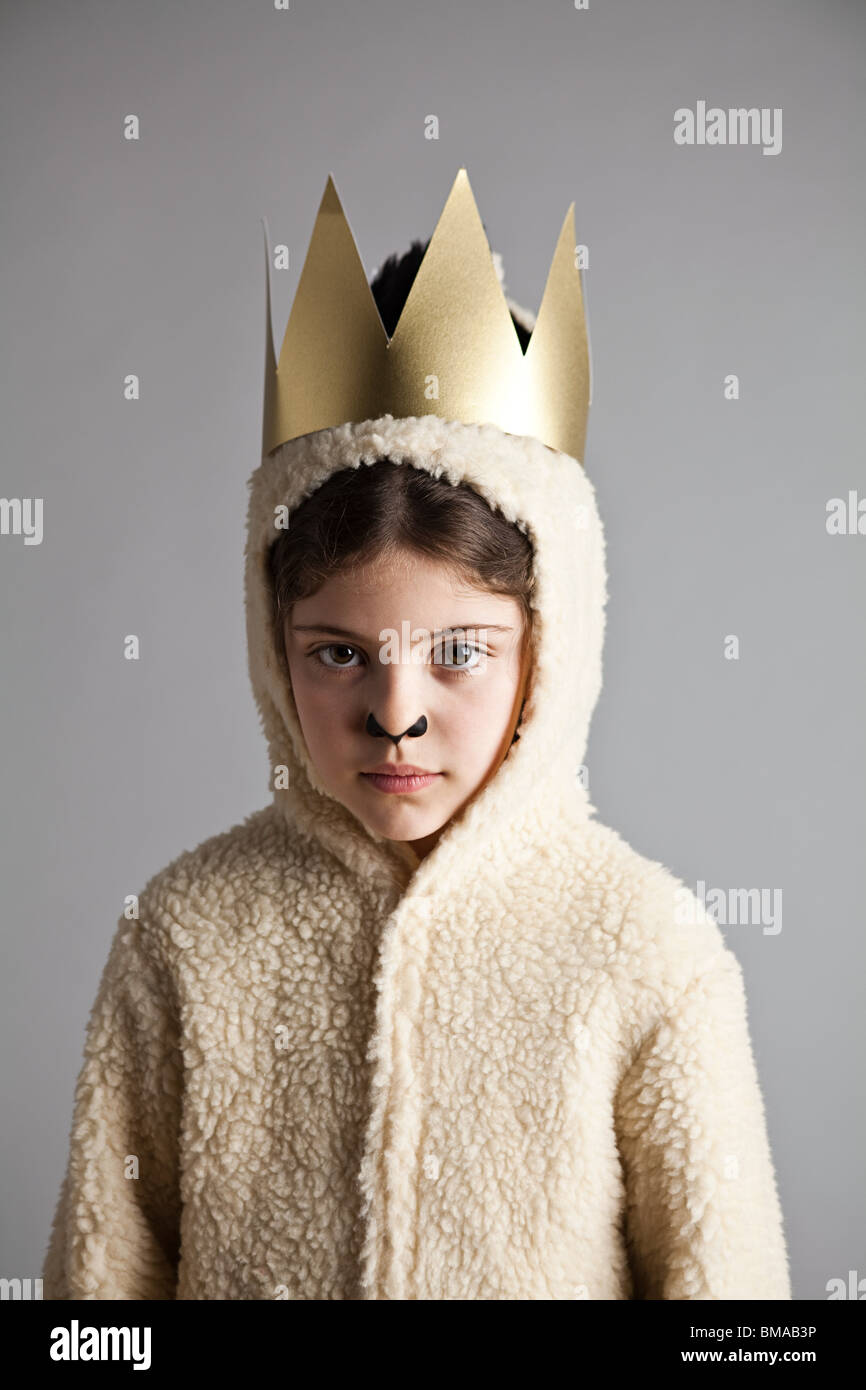 Young girl dressed up as sheep, wearing gold crown Stock Photo