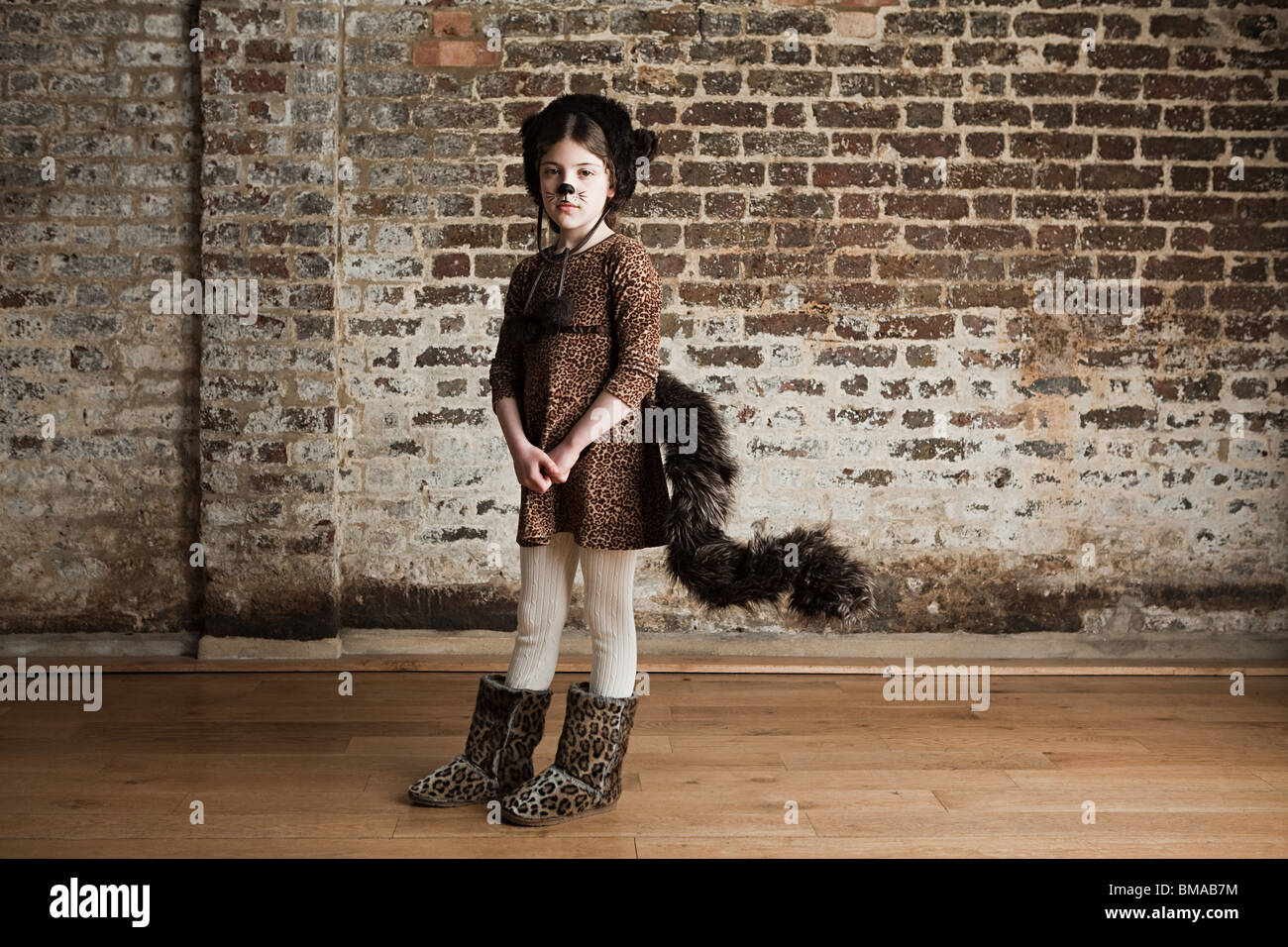 Young girl dressed up as cat Stock Photo