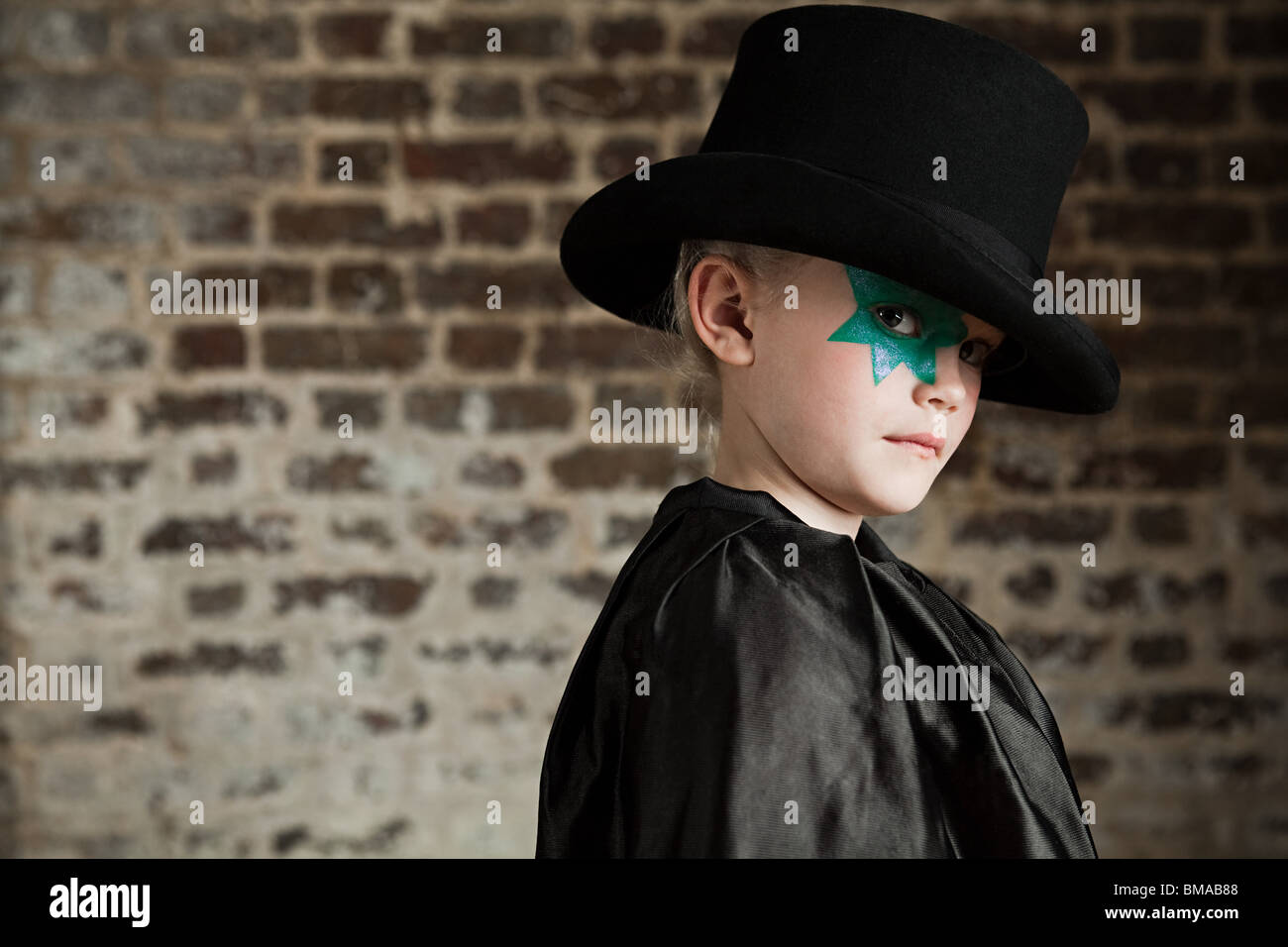 Young girl dressed up as magician wearing top hat Stock Photo Alamy